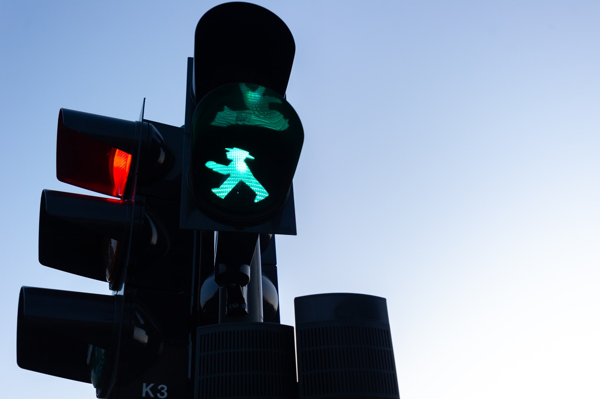 Traffic lights with a green light for pedestrians.